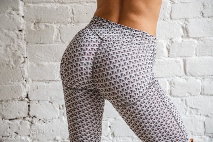 woman in black and white yoga pants